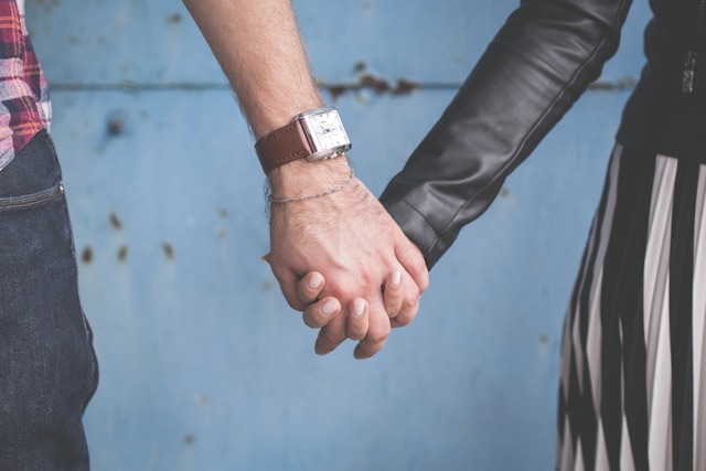 gentleman lady holding hands on date